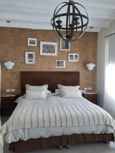 เตียงในห้องที่ El Cortijo Hotel Boutique