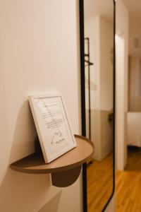 a book sitting on a shelf in a room at HausPension in Vienna