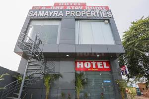 a hotel with a sign that reads samaya spa properties at Capital O A-one in Manesar