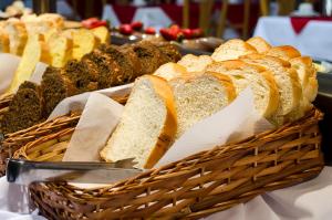 a basket filled with bread on top of a table at Hotel Dunamys Curitiba in Curitiba