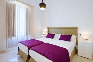 BiBo Suites Gran Vía में एक कमरे में एक या कई बेड