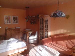 a living room with a couch and a table at Appartement Haus Hamburg in Bad Füssing