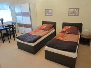 Apartment Erfordia Erfurt am Egapark में एक कमरे में एक या कई बेड