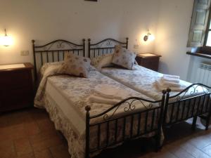 Una cama o camas en una habitación de Podere Poggio Benedetto