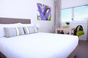 Voodi või voodid majutusasutuse Domain Serviced Apartments toas