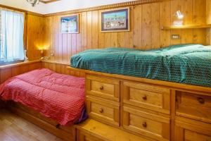 Cama ou camas em um quarto em Villa Franchetti - Stayincortina