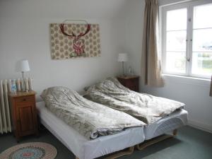 Tempat tidur dalam kamar di Thurø Kro B&B