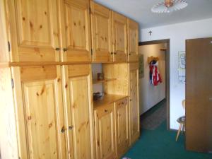 a room with wooden cabinets in a room at Monolocale Milky Way - Sestriere in Sestriere