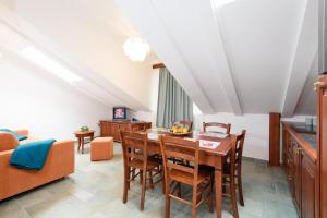 a kitchen and dining room with a table and chairs at Villa Meri in Trogir