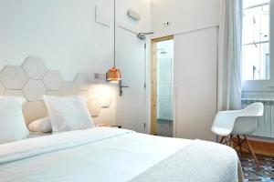 เตียงในห้องที่ La Casa de Antonio Boutique Rooms