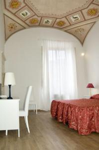 Tempat tidur dalam kamar di Relais La Corte dei Cavalieri