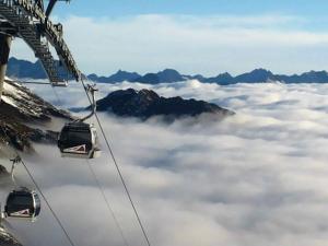 a gondola ride above the clouds in the mountains at Gästehaus Sissy in Längenfeld