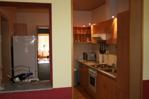 a kitchen with a white refrigerator and a sink at family & friends in Wernigerode