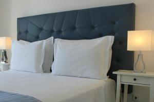 Ein Bett oder Betten in einem Zimmer der Unterkunft River Inn - Duna Parque Resorts & Hotels