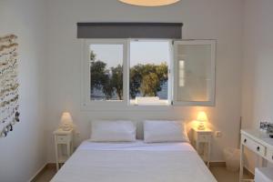 Vuode tai vuoteita majoituspaikassa Almira Suites - Seafront - Naousa Paros