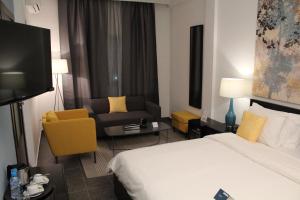 เตียงในห้องที่ Hôtel Semiramis City Center