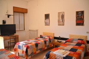 Cama ou camas em um quarto em Albergo Roma