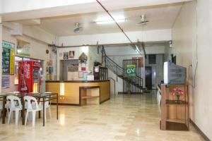 a restaurant with a table and chairs in a room at GV Hotel - Dipolog in Dipolog