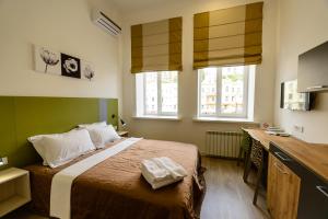 מיטה או מיטות בחדר ב-Partner Guest House Baseina