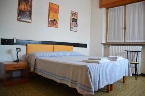 Cama ou camas em um quarto em Albergo Roma