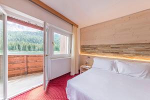 Una cama o camas en una habitación de Hotel Sorapiss