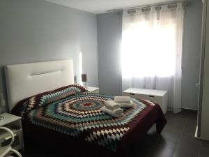 Postel nebo postele na pokoji v ubytování Apartamento Turístico Obispo36 en Orihuela ciudad