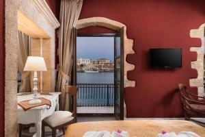 a hotel room with a view of the water at Cretan Renaissance in Chania Town