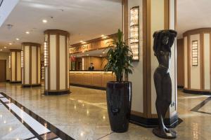 a statue of a woman standing in a lobby at Maritim Hotel Dresden in Dresden