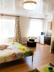 En eller flere senger på et rom på Bishkek Flatlux Apartments