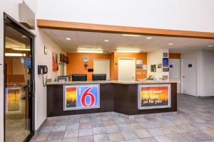 a lobby of a hospital with a reception counter at Motel 6-Waterloo, IA in Waterloo