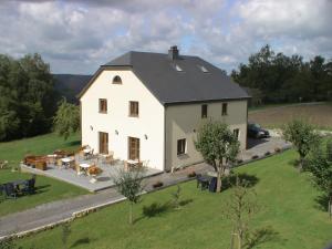 an aerial view of a large white house at L'orchidée in Rochehaut