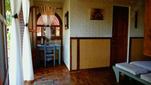 A bed or beds in a room at Eco Lodge Les Chambres Du Voyageur