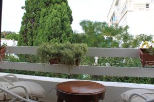 a balcony with a table and potted plants on it at Villa Sidi Bou Said in Sidi Bou Saïd