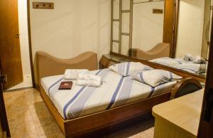 Voodi või voodid majutusasutuse Hotel Ordenes (Adult Only) toas