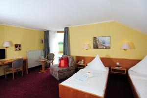 מיטה או מיטות בחדר ב-Landhotel Plauen - Gasthof Zwoschwitz