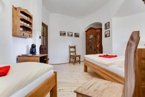 A bed or beds in a room at Krumlov Tower