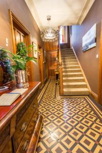 a hallway with a stairway with a staircase at Jerichos Boutique Accommodation in Windermere