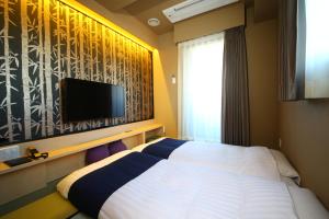 Krevet ili kreveti u jedinici u objektu Hotel Wing International Select Asakusa Komagata