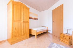 Una cama o camas en una habitación de Apartments Ilmtal-Jena