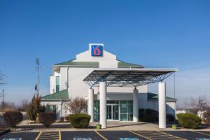 a gas station with a sign on top of it at Motel 6-Dale, IN in Dale