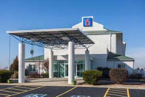 a gas station with a sign on top of it at Motel 6-Dale, IN in Dale