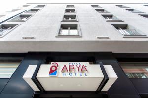 a sign for a hotel in front of a building at Perla Arya Hotel in Izmir