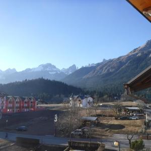 a view of a town with mountains in the background at Appartamento Mariastella in Andalo