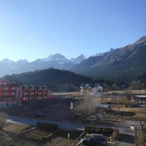 a view of a city with mountains in the background at Appartamento Mariastella in Andalo