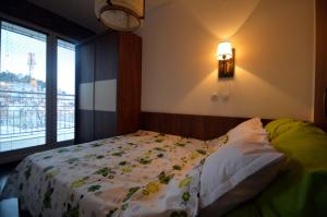 Voodi või voodid majutusasutuse Ohrid Boutique Apartments toas