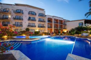 a large swimming pool in front of a building at Flamingo Vallarta Hotel & Marina in Puerto Vallarta