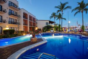 a swimming pool in front of a hotel at Flamingo Vallarta Hotel & Marina in Puerto Vallarta