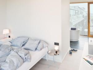 Tempat tidur dalam kamar di Inselloft Norderney