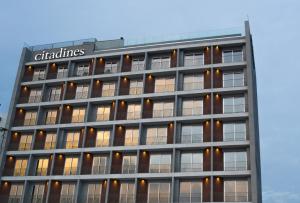 an office building with a sign on the side of it at Citadines OMR Chennai in Chennai