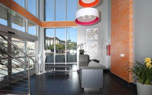 a lobby of a building with a large window at Lexen Hotel - Hollywood in Los Angeles